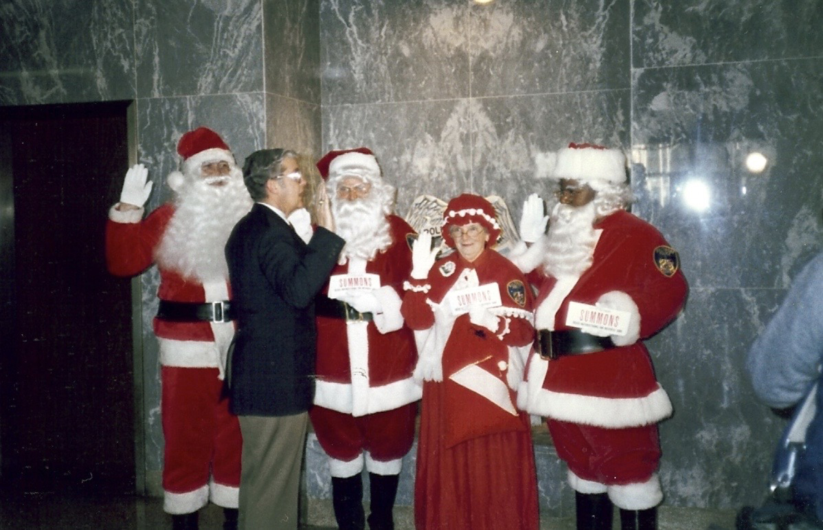 Lt Wilson swear s in Santas Thousands of Summons reminding people to lock their cars and put valuables out of site were placed on vehicles in Baltimore